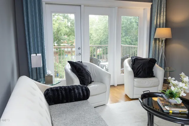 a living room with furniture and a lamp