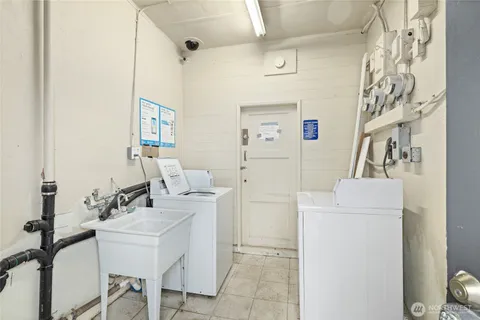 a bathroom with a sink a mirror and a shower curtain