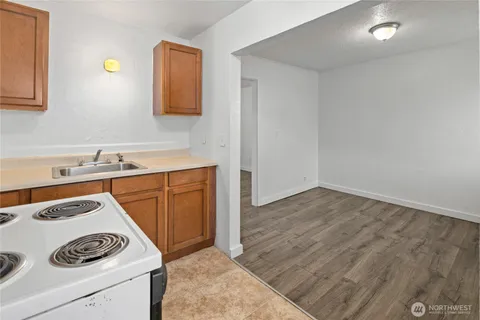 a utility room with a sink dryer and washer