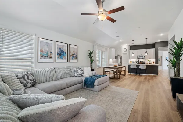 a living room with furniture and a large window