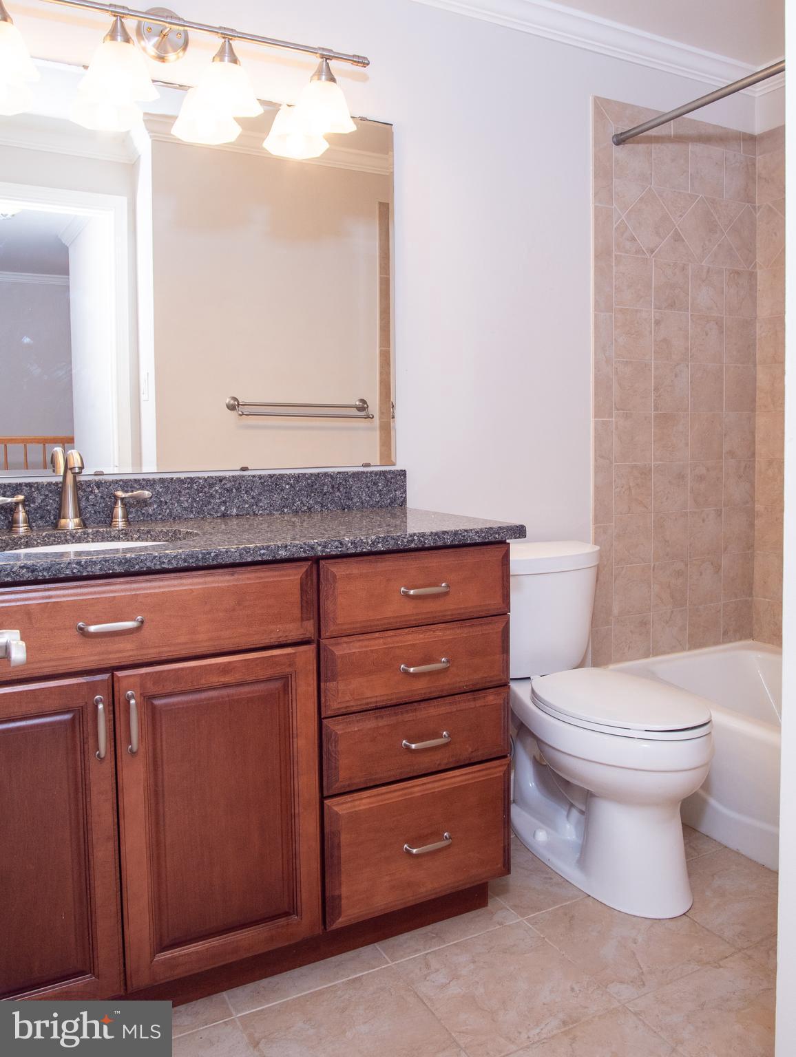 9758 Early Spring Way Columbia, MD 21046 - Photo 15 of 29 2nd Level Hall Bathroom (tile flooring)
