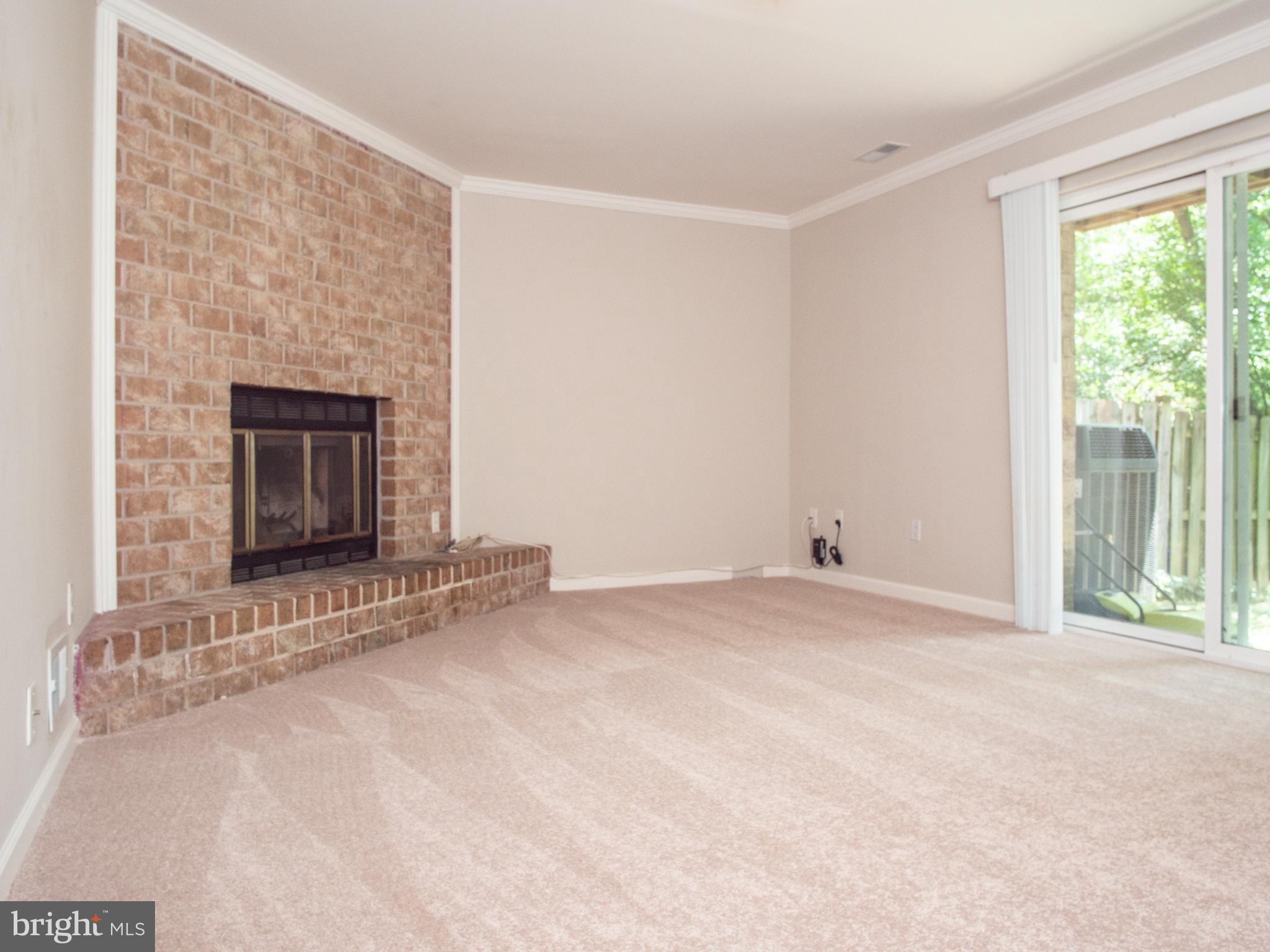 9758 Early Spring Way Columbia, MD 21046 - Photo 23 of 29 Basement Family Room with Wood-Burning Fireplace