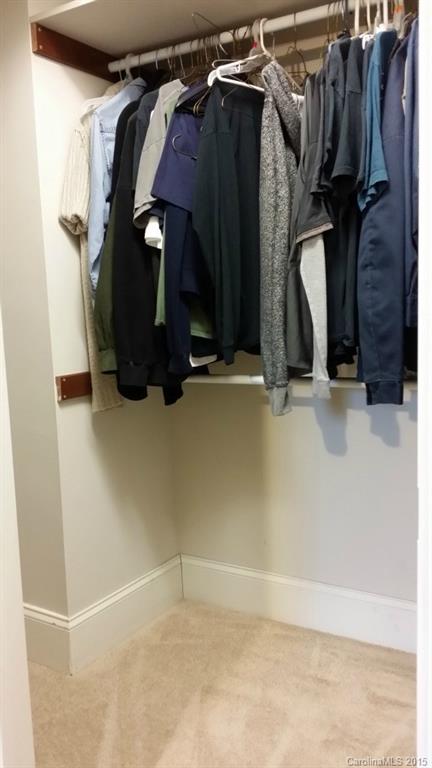 10060 Unity Church Road Mooresville, NC 28115 - Photo 14 of 22 a view of walk in closet with clothes and shoes