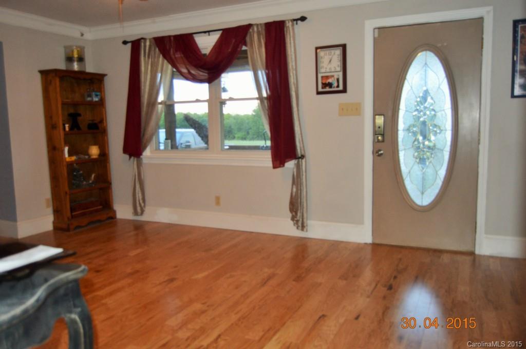 10060 Unity Church Road Mooresville, NC 28115 - Photo 21 of 22 a view of a livingroom with wooden floor and a window