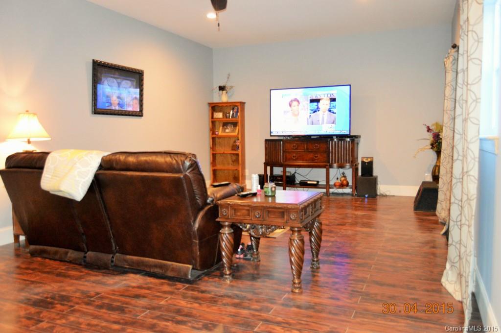10060 Unity Church Road Mooresville, NC 28115 - Photo 5 of 22 a workspace with furniture and wooden floor