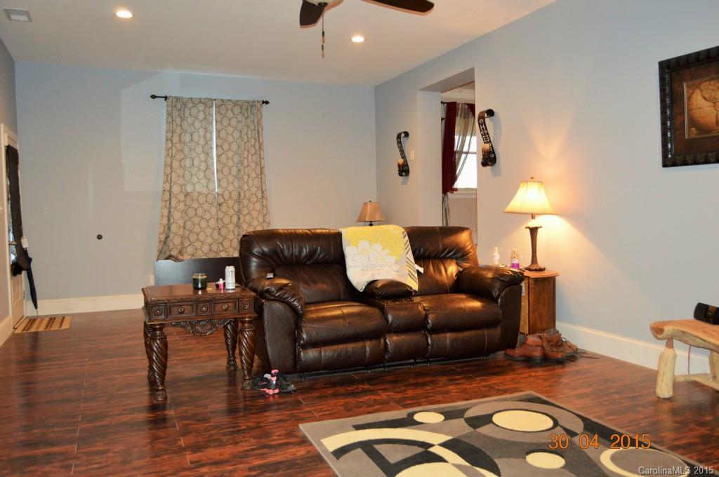 10060 Unity Church Road Mooresville, NC 28115 - Photo 6 of 22 a living room with furniture and wooden floor