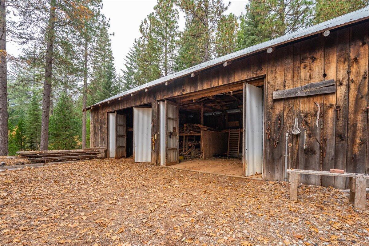 29104 Johnson Road Montgomery Creek, CA 96065 - Photo 118 of 137 a view of a house with a backyard and porch