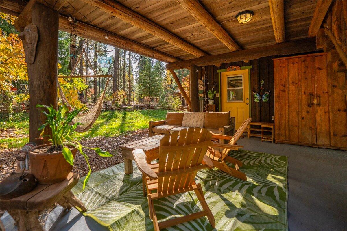 29104 Johnson Road Montgomery Creek, CA 96065 - Photo 18 of 137 a living room with furniture and a floor to ceiling window