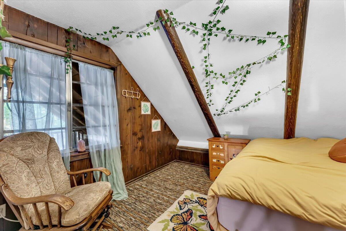 29104 Johnson Road Montgomery Creek, CA 96065 - Photo 40 of 137 a bedroom with a bed couch and a window