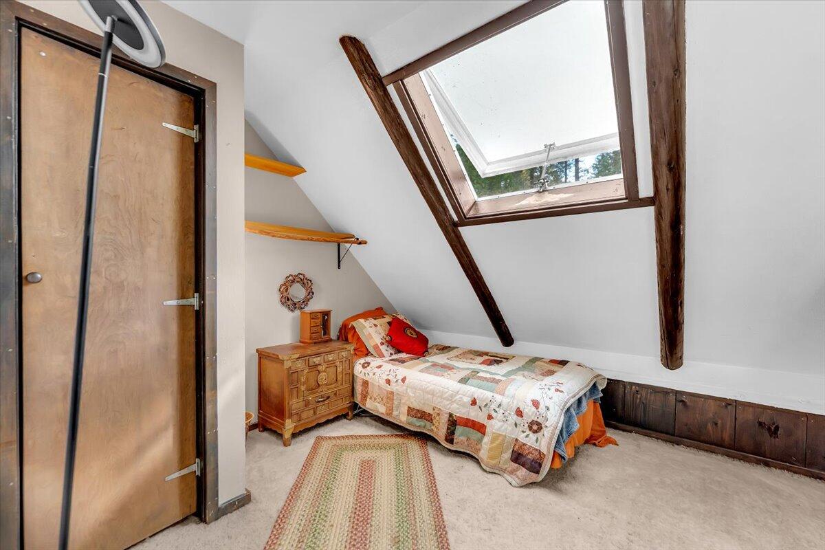 29104 Johnson Road Montgomery Creek, CA 96065 - Photo 42 of 137 a bedroom with a bed and a large window