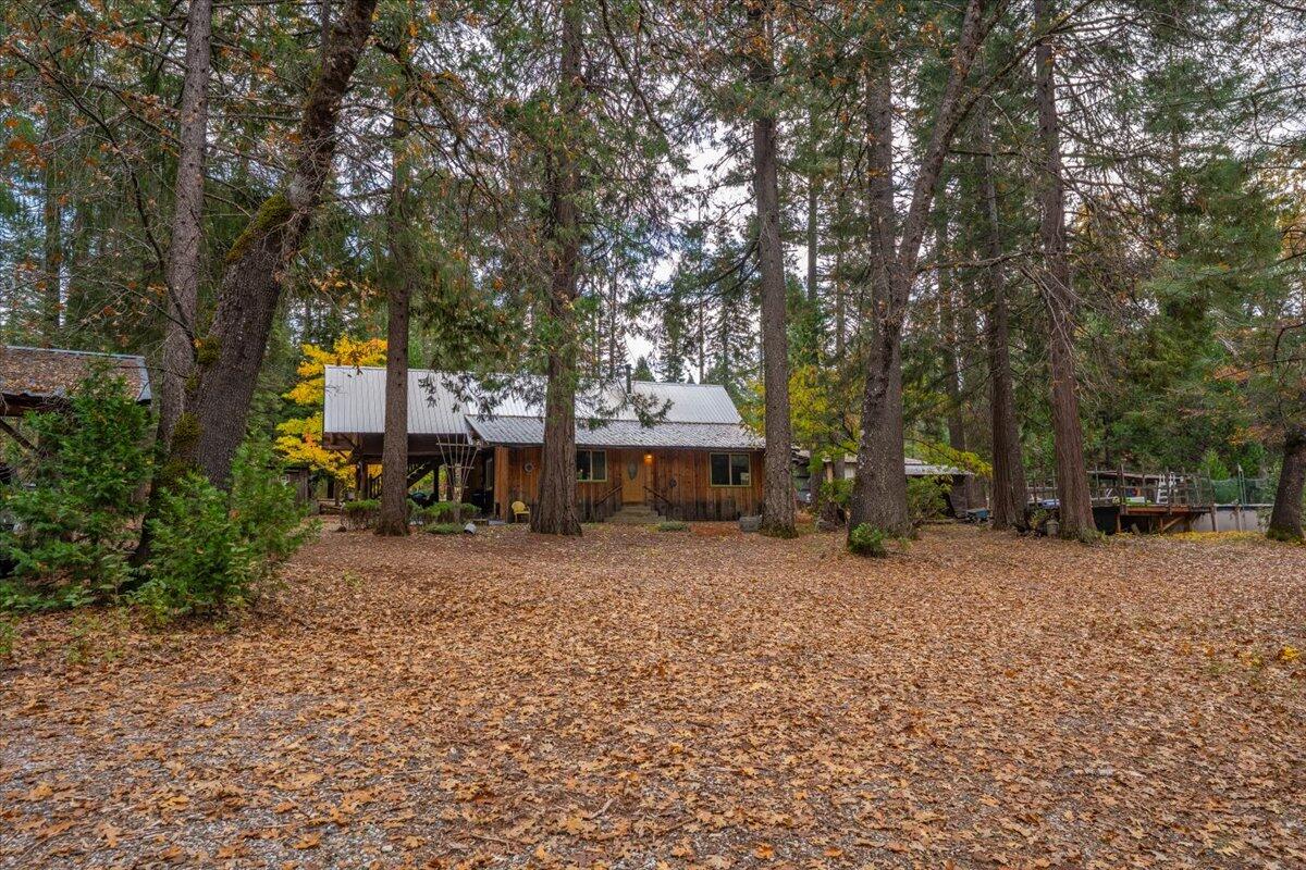 29104 Johnson Road Montgomery Creek, CA 96065 - Photo 5 of 137 a house with a tree in front of it