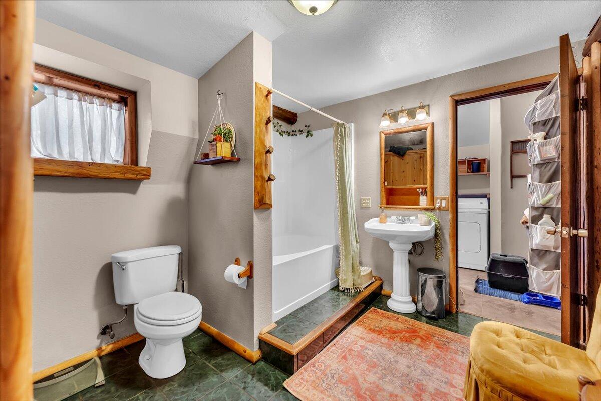 29104 Johnson Road Montgomery Creek, CA 96065 - Photo 52 of 137 a bathroom with a toilet and a shower