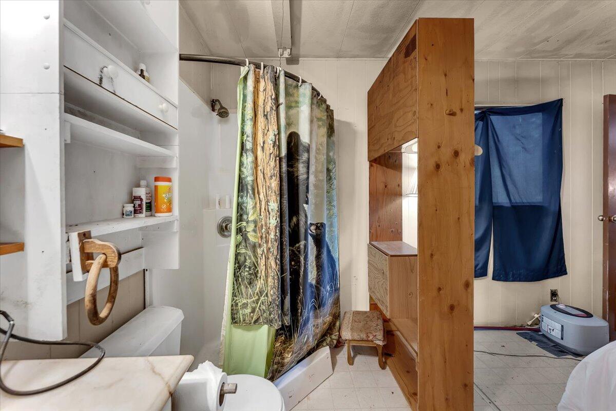 29104 Johnson Road Montgomery Creek, CA 96065 - Photo 66 of 137 a view of walk in closet with clothes and shoes