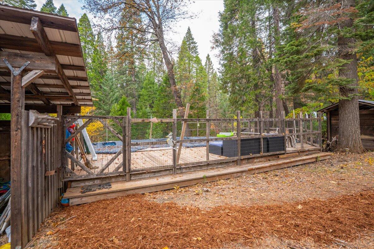 29104 Johnson Road Montgomery Creek, CA 96065 - Photo 81 of 137 a view of a backyard with wooden fence and a bench