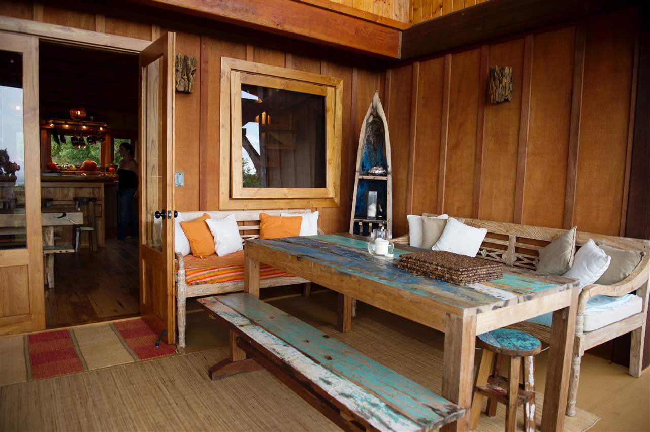 56 West Waipio Road Haiku, HI 96708 - Photo 5 of 25 a view of kitchen island with granite countertop a sink and a wooden floor