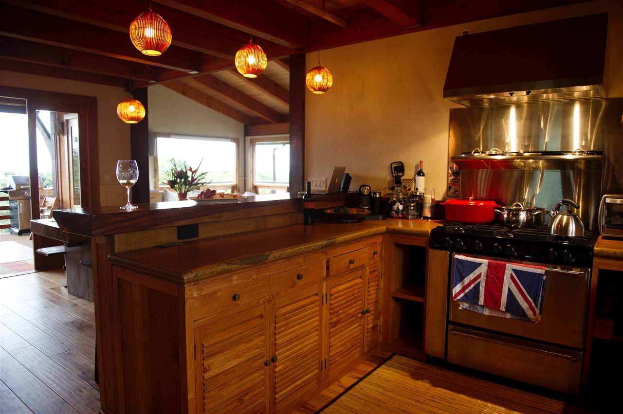 56 West Waipio Road Haiku, HI 96708 - Photo 6 of 25 a kitchen with stainless steel appliances wooden floor dining table and chairs