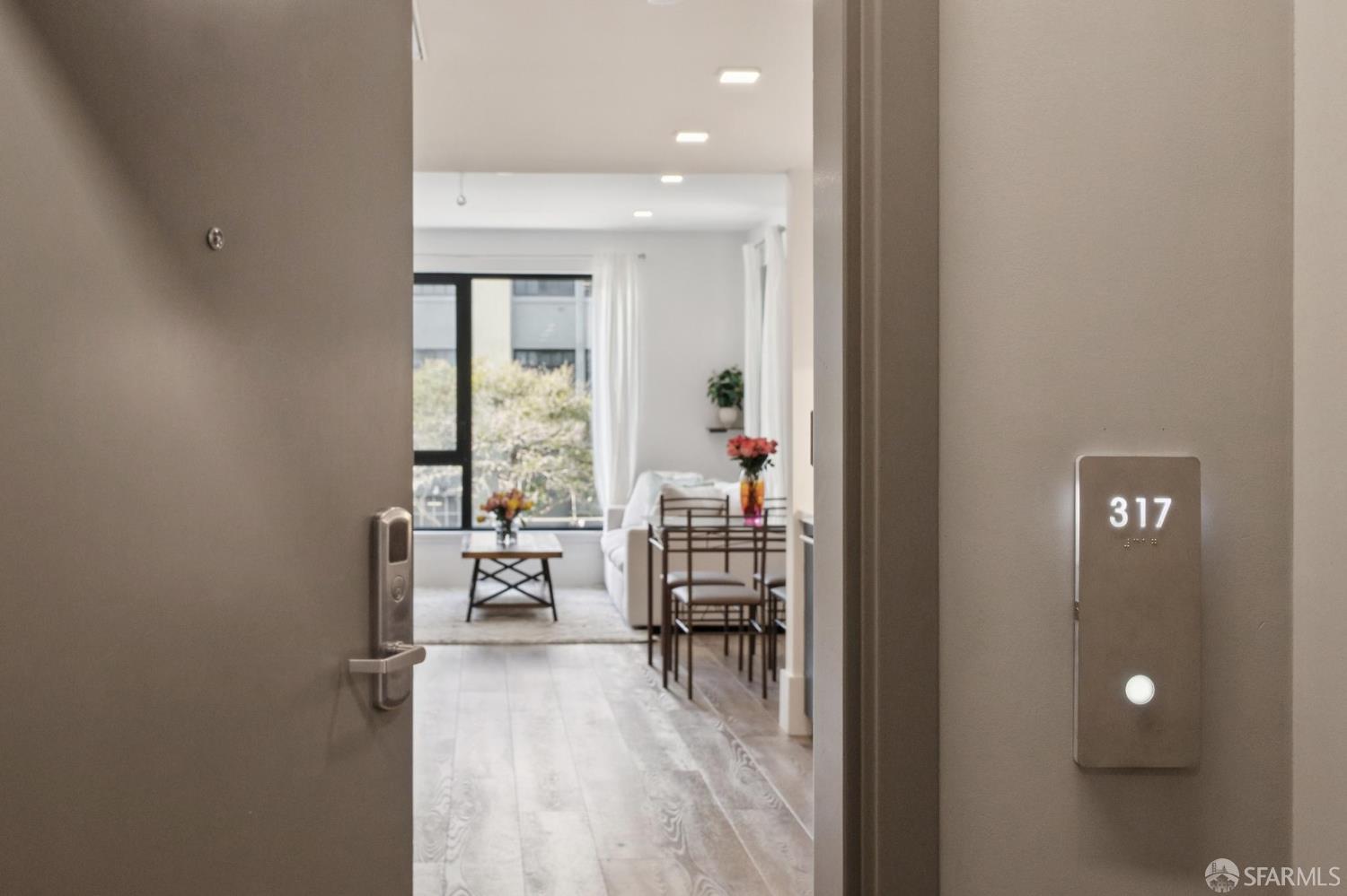 a dining room with furniture and wooden floor