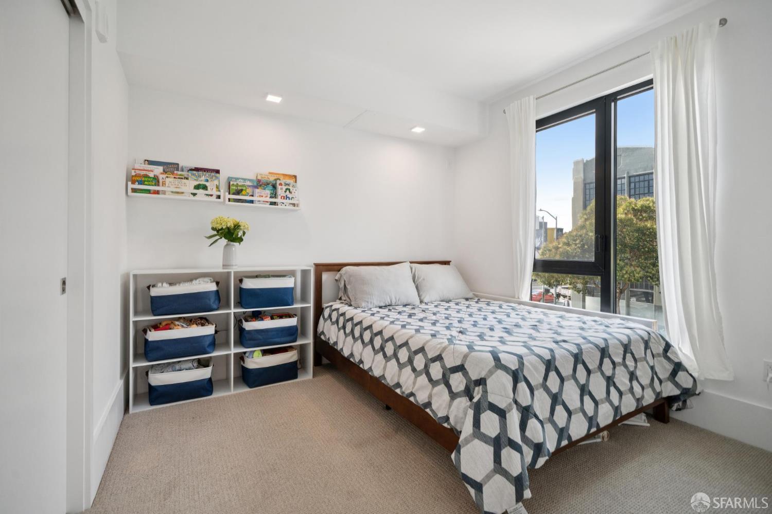 1288 Howard Street, Unit 317 San Francisco, CA 94103 - Photo 16 of 57 a bedroom with a bed and a window