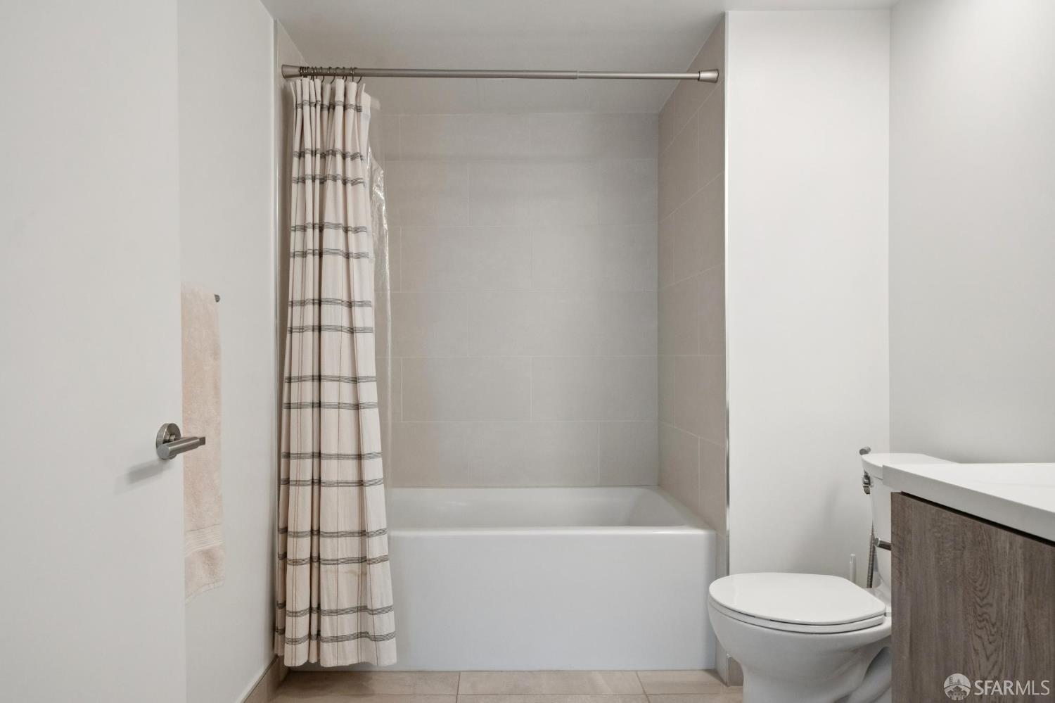 1288 Howard Street, Unit 317 San Francisco, CA 94103 - Photo 20 of 57 a bathroom with a bathtub and a toilet