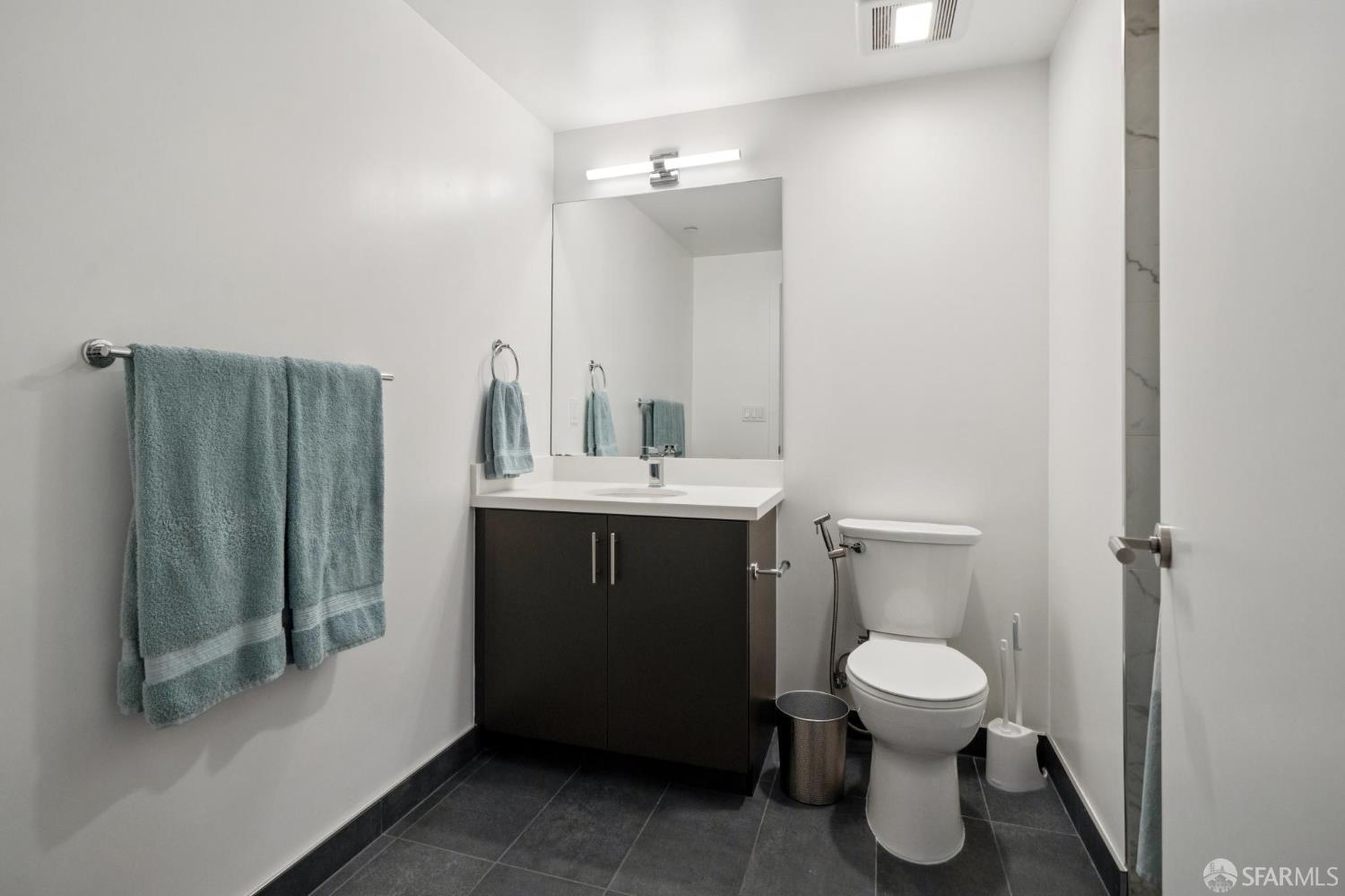 1288 Howard Street, Unit 317 San Francisco, CA 94103 - Photo 30 of 57 a bathroom with a sink and a toilet