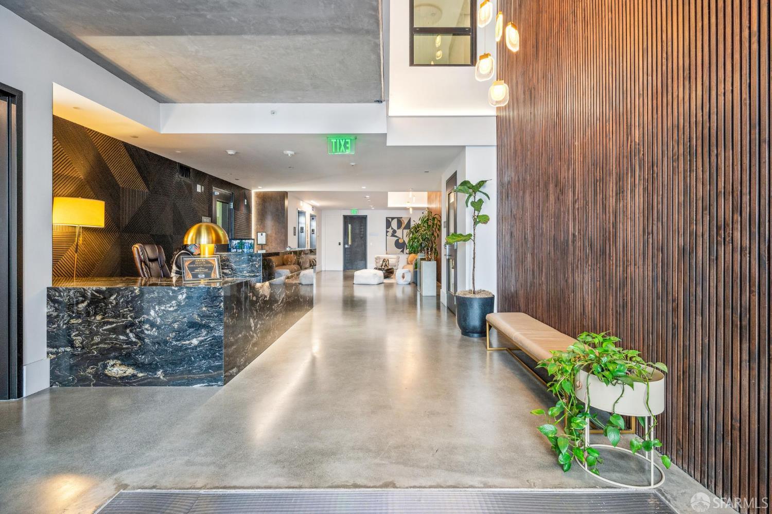 1288 Howard Street, Unit 317 San Francisco, CA 94103 - Photo 36 of 57 a lobby with furniture and a potted plant