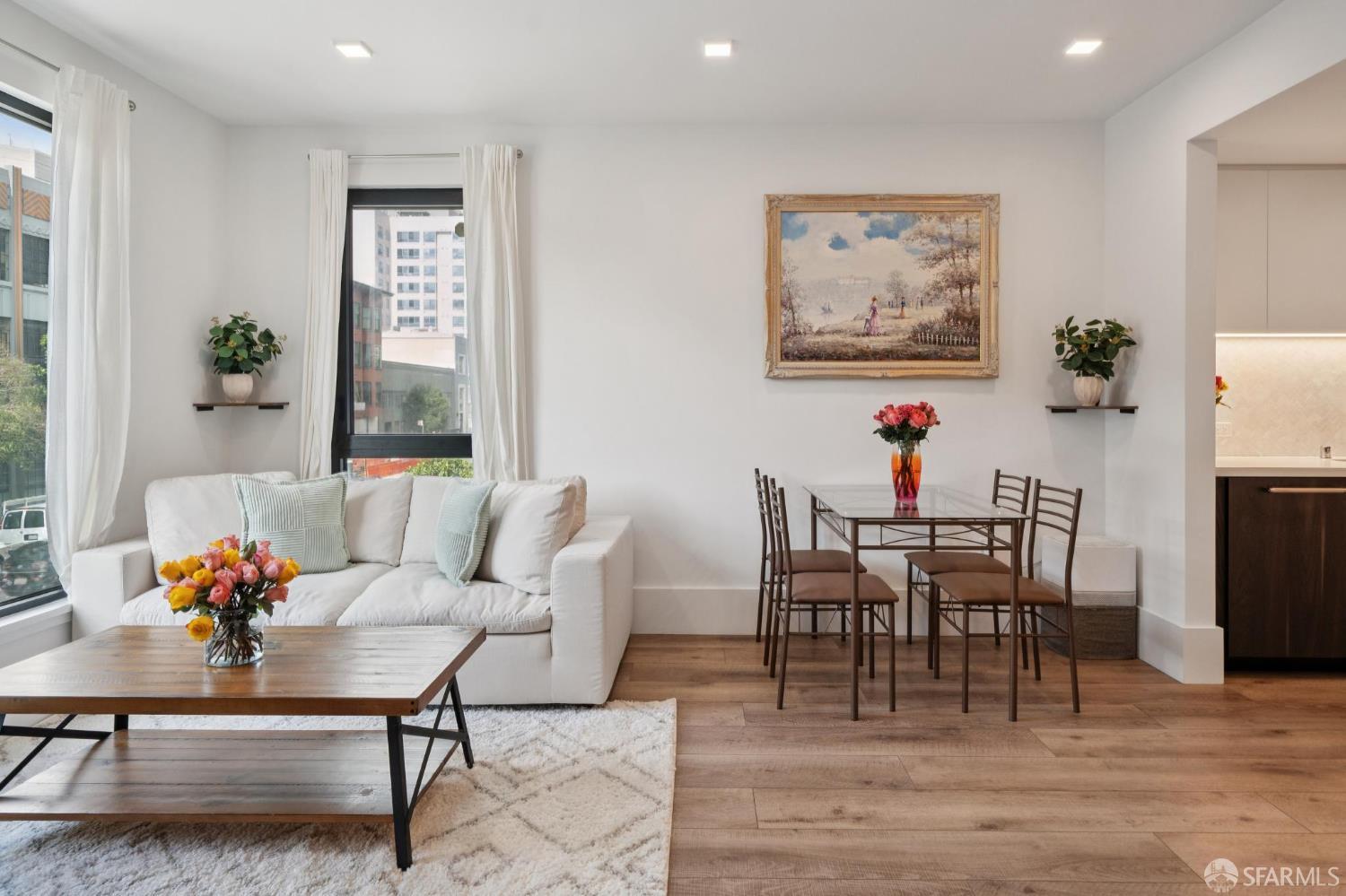 1288 Howard Street, Unit 317 San Francisco, CA 94103 - Photo 7 of 57 a view of a dining room with furniture window and wooden floor