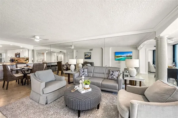 a bedroom with a large bed and a flat screen tv