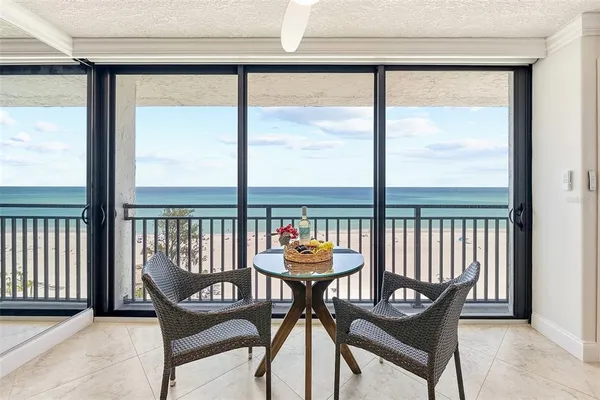 a bedroom with a bed a mirror and a lamp on dresser