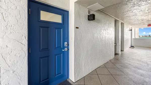 a view of a hallway with entryway door