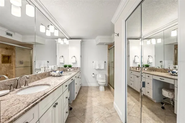 a bedroom with two beds and painted walls