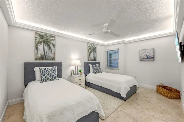 a bedroom with a bed a mirror and furniture