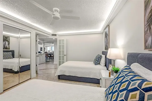a bathroom with a sink a mirror a vanity and shower
