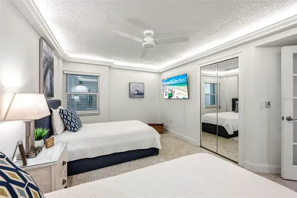 a view of building with swimming pool and sitting space