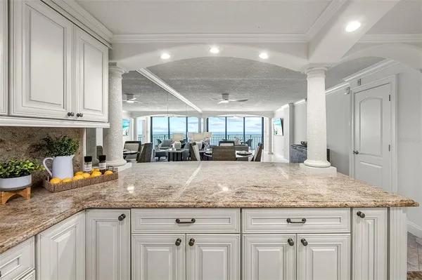 a kitchen with stainless steel appliances granite countertop a refrigerator and microwave