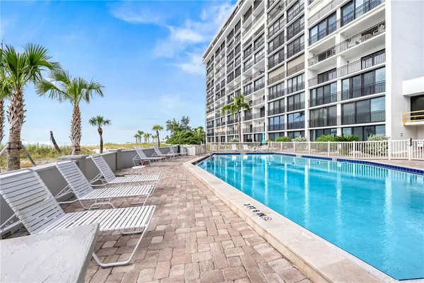 a view of a chairs and tables in the patio