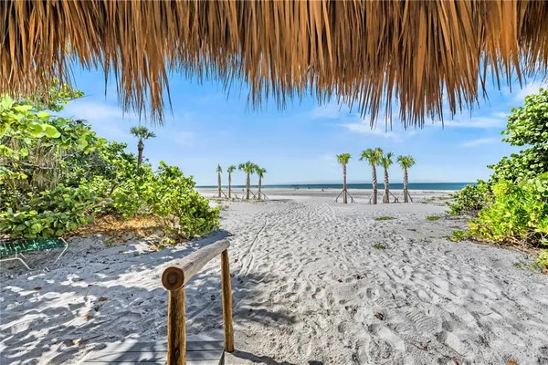 a view of people sitting in front of retail shops