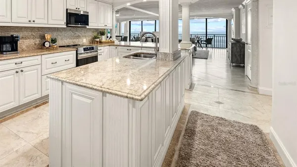 a large kitchen with granite countertop lots of counter top space