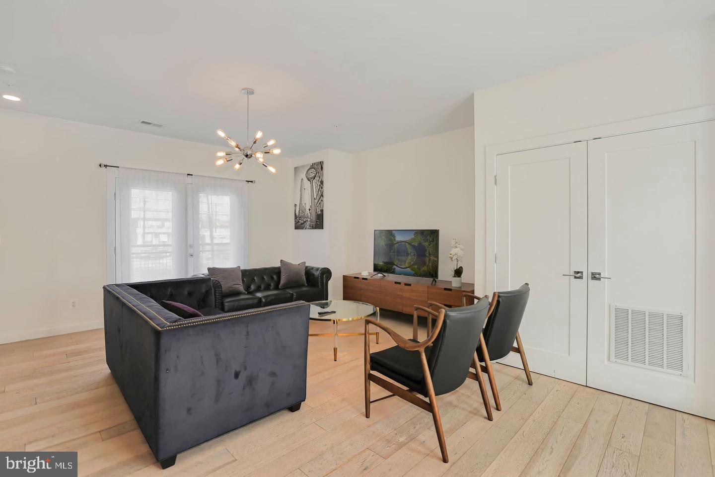 1495 Gallaudet Street Northeast Washington, DC 20002 - Photo 11 of 32 a view of a dining room with furniture and wooden floor