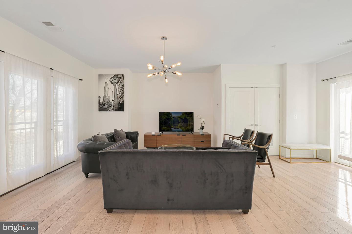 1495 Gallaudet Street Northeast Washington, DC 20002 - Photo 12 of 32 a living room with furniture and a flat screen tv