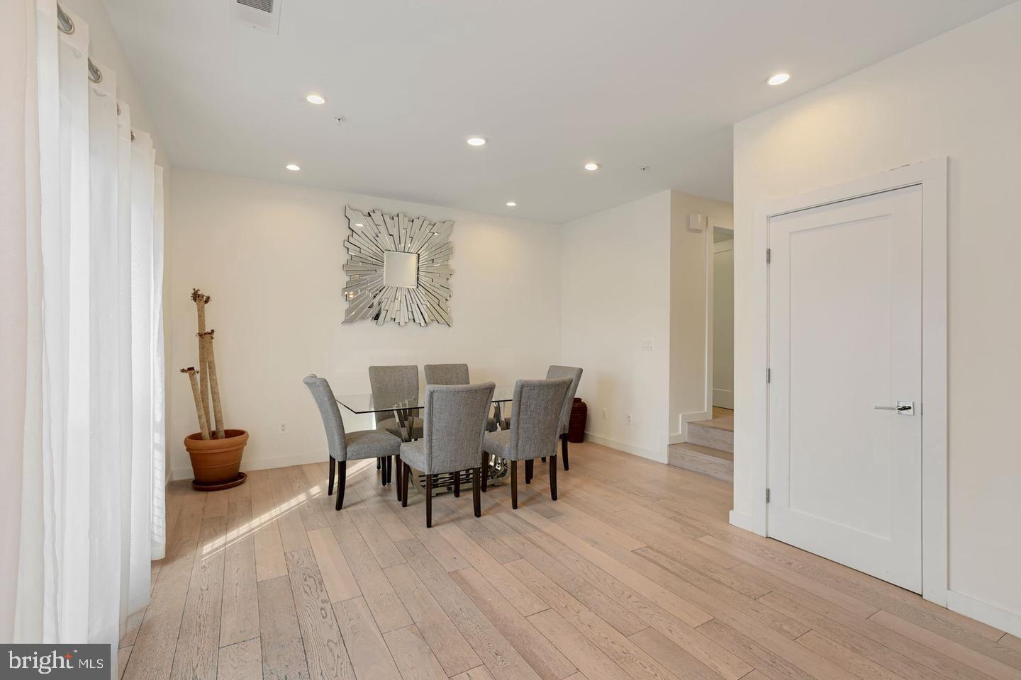1495 Gallaudet Street Northeast Washington, DC 20002 - Photo 13 of 32 a view of a dining room with furniture and wooden floor