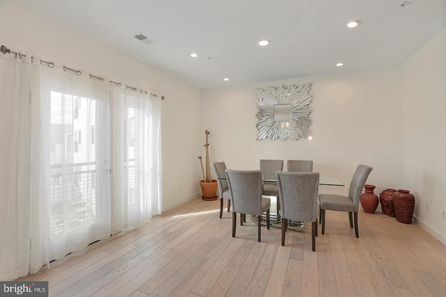 1495 Gallaudet Street Northeast Washington, DC 20002 - Photo 14 of 32 a view of a dining room with furniture and wooden floor