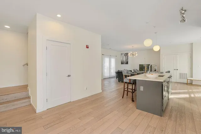 a view of a kitchen with a sink and breakfast area