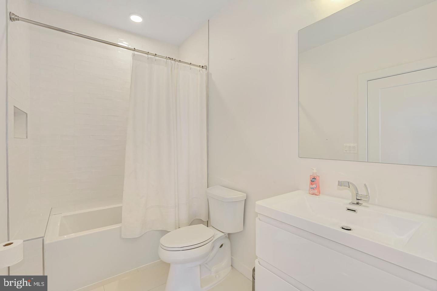 1495 Gallaudet Street Northeast Washington, DC 20002 - Photo 21 of 32 a bathroom with a sink toilet and shower