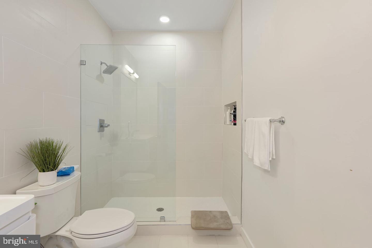 1495 Gallaudet Street Northeast Washington, DC 20002 - Photo 27 of 32 a bathroom with a toilet and a shower