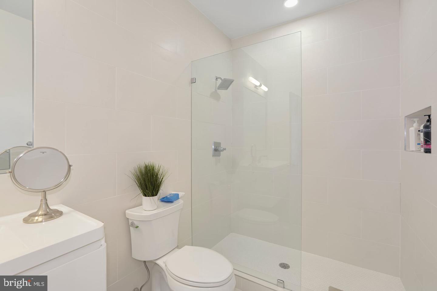 1495 Gallaudet Street Northeast Washington, DC 20002 - Photo 28 of 32 a bathroom with a toilet sink and shower