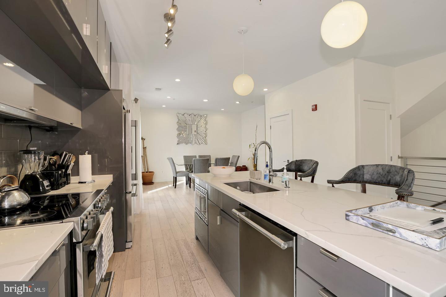 1495 Gallaudet Street Northeast Washington, DC 20002 - Photo 8 of 32 a kitchen with lots of counter space and view of living room