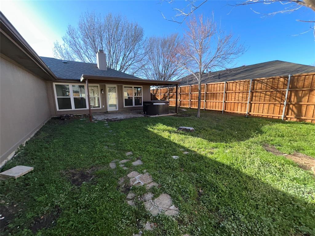 2218 Fuqua Road Rowlett, TX 75088 - Photo 12 of 14 a view of a house with a backyard