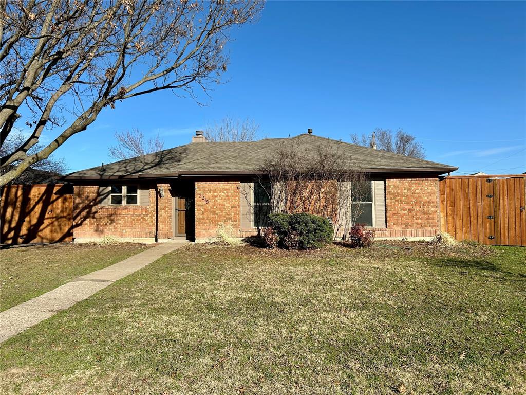 2218 Fuqua Road Rowlett, TX 75088 - Photo 2 of 14 a view of a house with a yard
