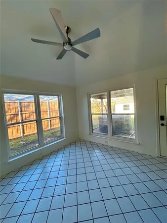 a view of an empty room and window