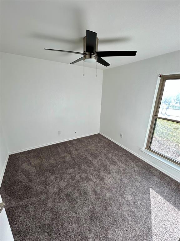 2218 Fuqua Road Rowlett, TX 75088 - Photo 9 of 14 a view of a room with a window and a ceiling fan